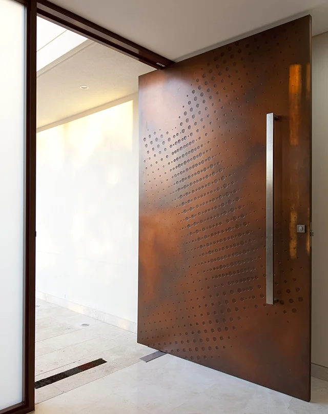 Orbit Carved Door in Copper Smooth Pearl Patina